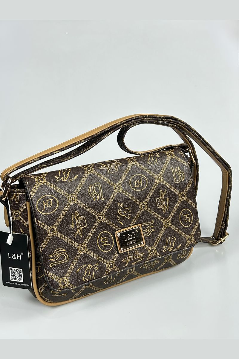 Τσάντα ώμου με λεπτομέρειες και σχεδια.